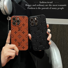 Image of an Upcycled Louis Vuitton iPhone 13 wallet phone case, showcasing the unique design and craftsmanship